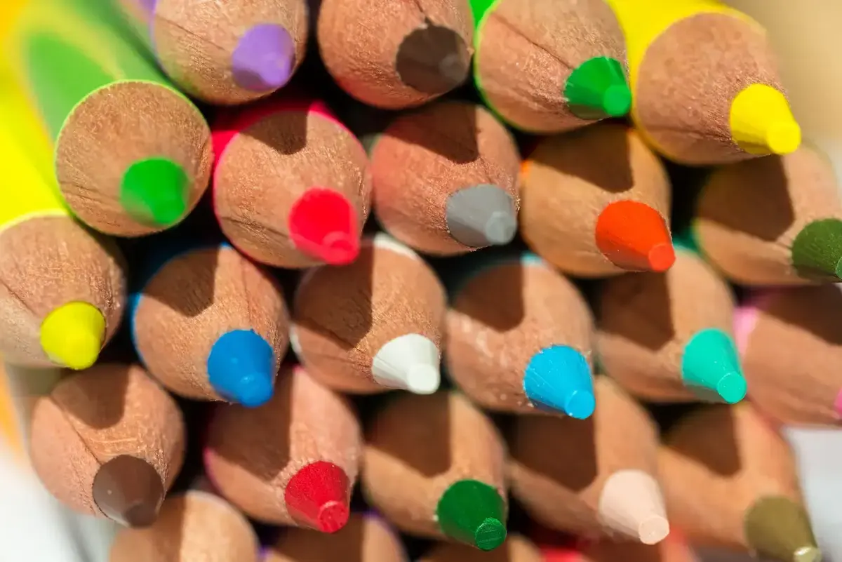 Diverse boards concept: image of a stack of pencils of different colours